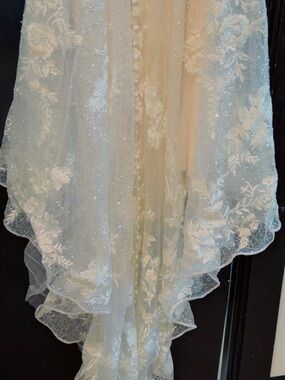 Allure Bridals Satin Label on Cream Bridal Fabric